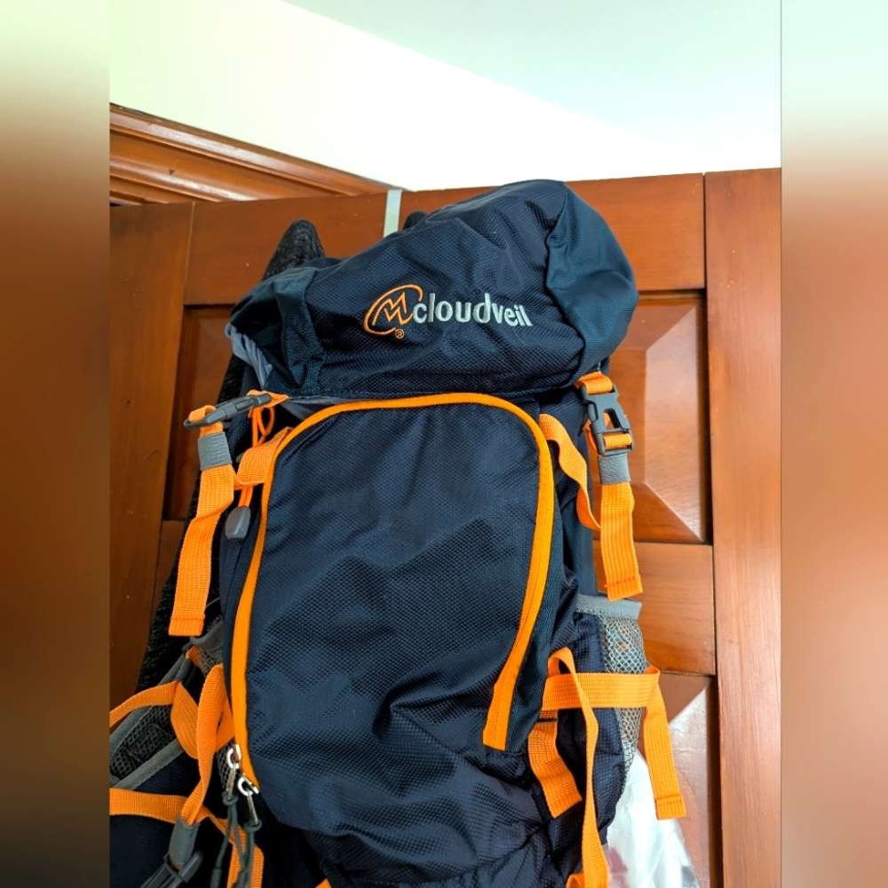 Navy Blue Hiking Backpack with Padded Straps and Bright Orange Accents